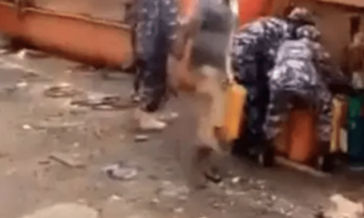  Viral video Police react to uniformed men scooping fuel from crashed tanker 