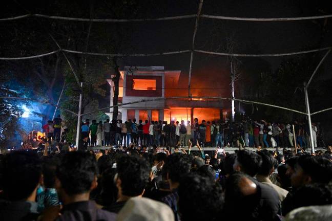 Massive protests erupt in Bangladesh as demonstrators raze buildings linked to former leader Massive protests erupt in Bangladesh as demonstrators raze buildings linked to former leader