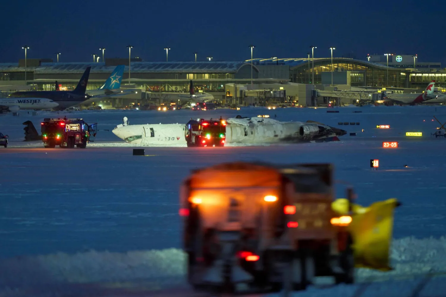 Delta plane flips upside down after crash landing at Toronto airport Delta plane flips upside down after crash landing at Toronto airport
