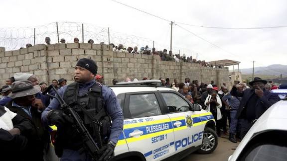 Gunmen kill 11 in early morning attack on South Africa hostel Gunmen kill 11 in early morning attack on South Africa hostel